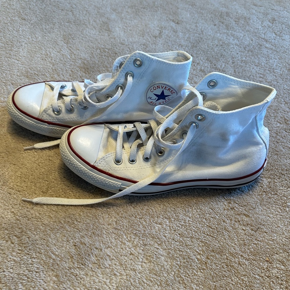 White gently-worn high-top converse